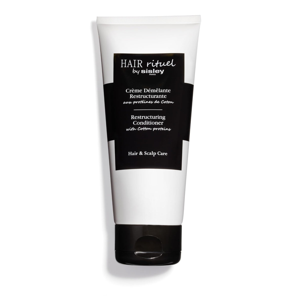 Sisley Paris Restructuring Conditioner bottle highlighting cotton proteins for smoother detangling.