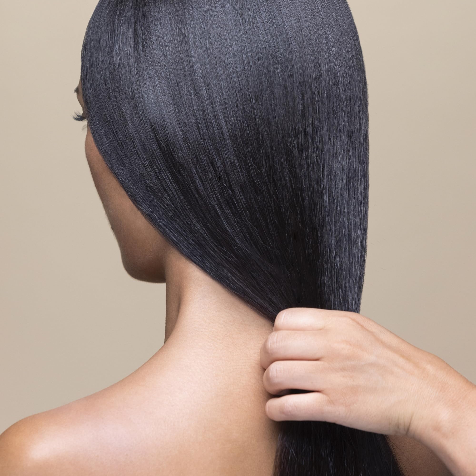 Hair after use looks detangled and manageable with Sisley Paris conditioner.