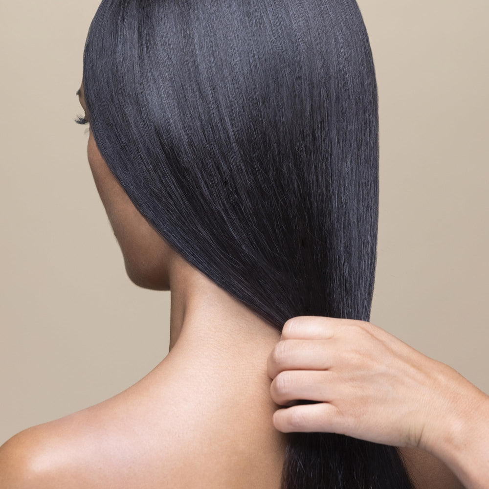 Hair after use looks detangled and manageable with Sisley Paris conditioner.