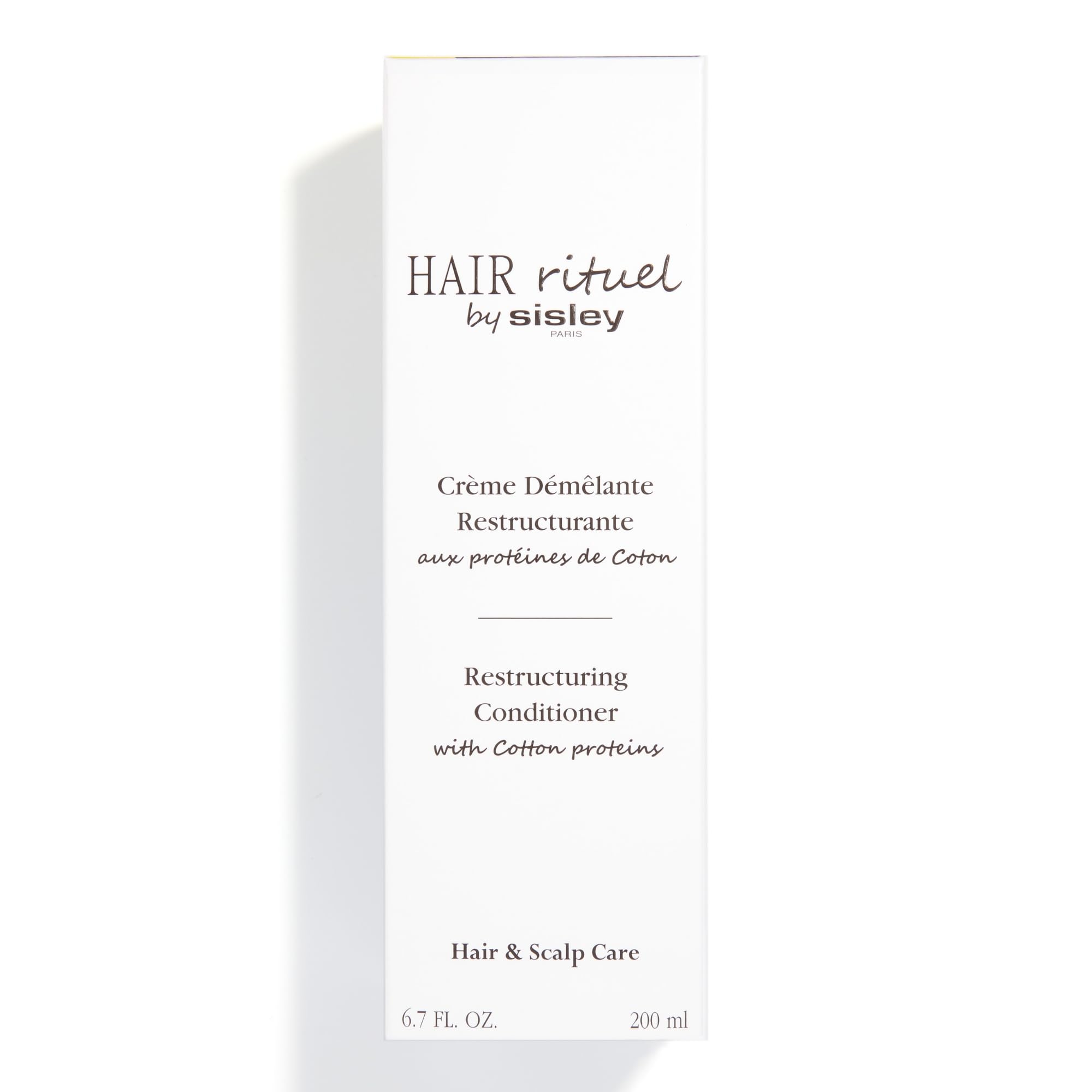 Shiny, soft hair after applying Sisley Paris Restructuring Conditioner.