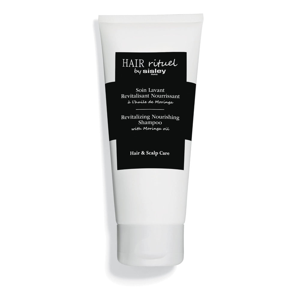 Sisley Paris Revitalizing Nourishing Shampoo bottle close-up for nourishing care