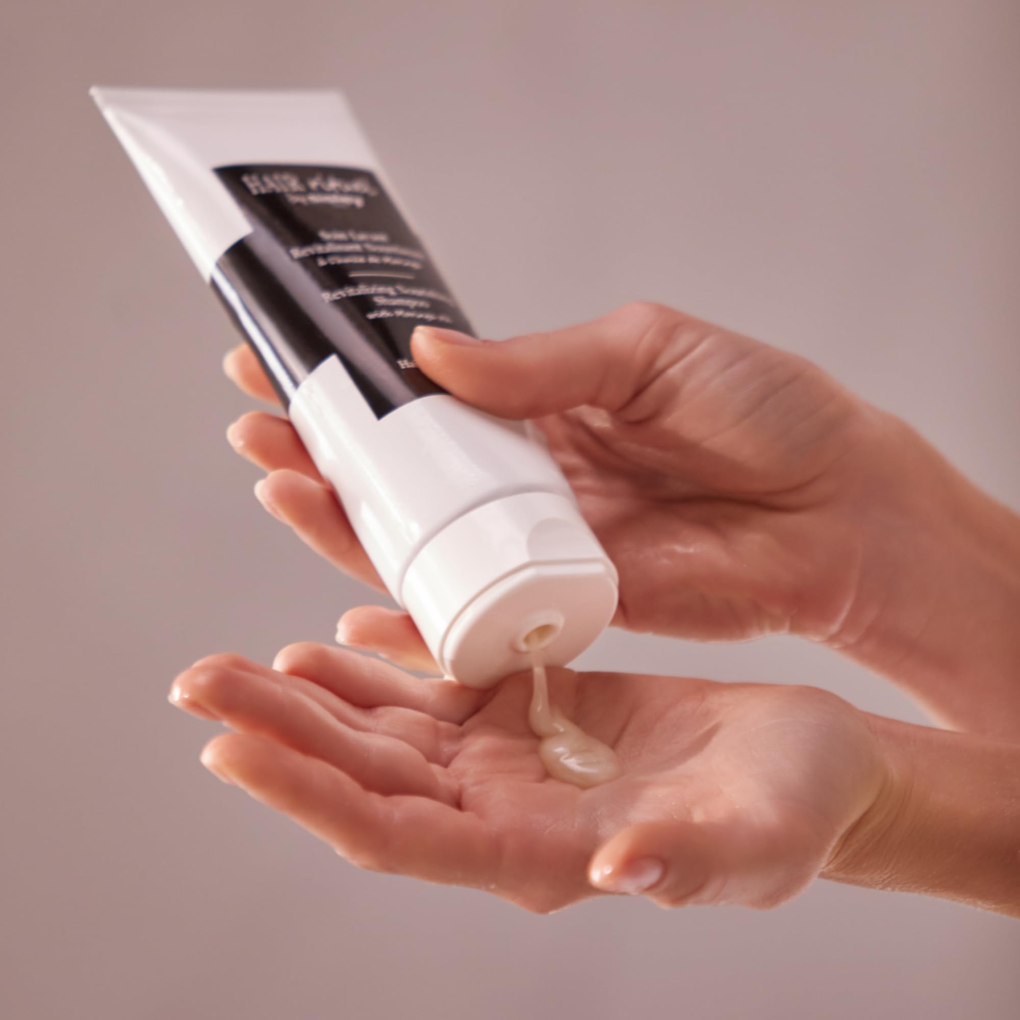 Sisley Paris Revitalizing Nourishing Shampoo pack-shot showing premium presentation