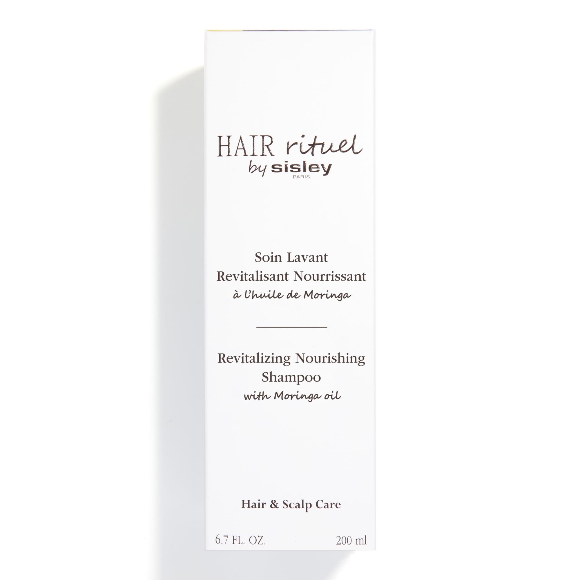 Sisley Paris Revitalizing Nourishing Shampoo texture close-up indicating silky results