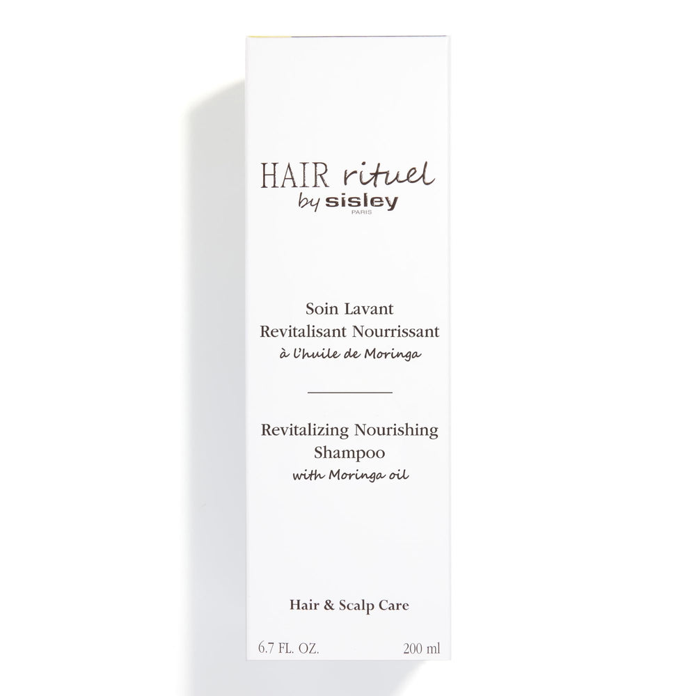 Sisley Paris Revitalizing Nourishing Shampoo texture close-up indicating silky results