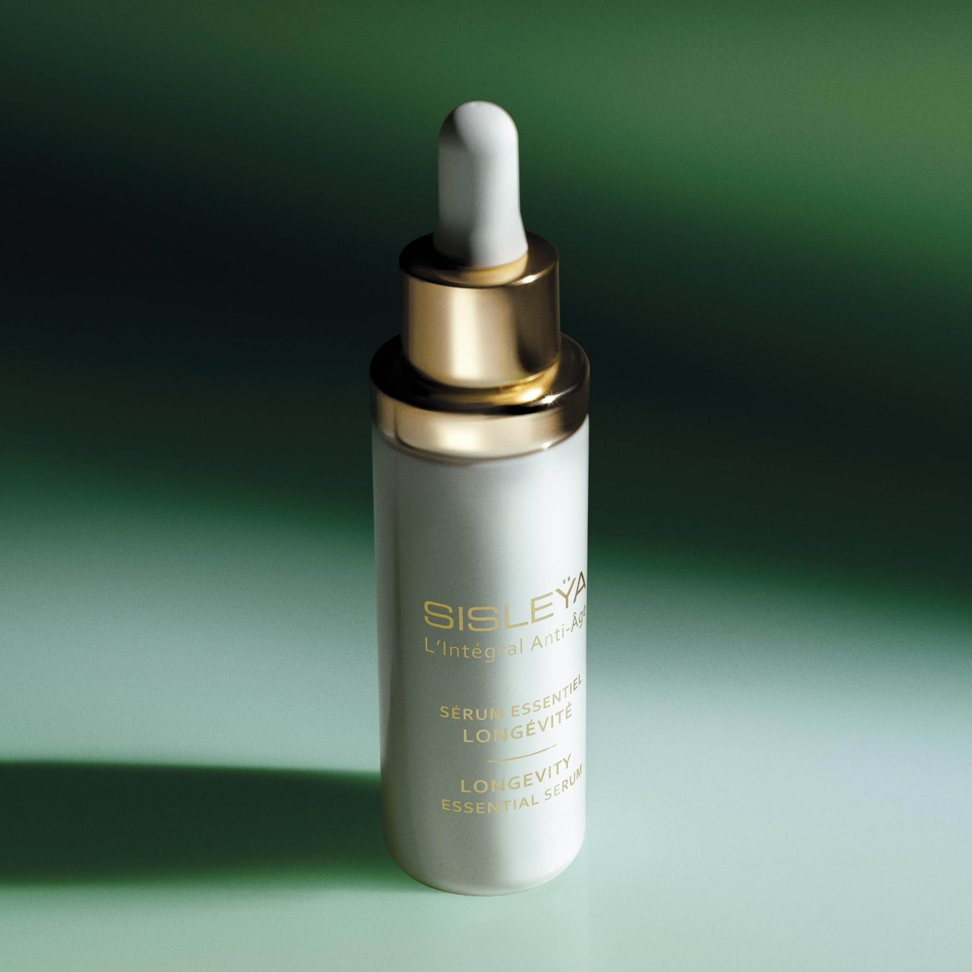 Sisley Paris Sisleya L'Integral Serum neck-area application suggests even-toned radiance.