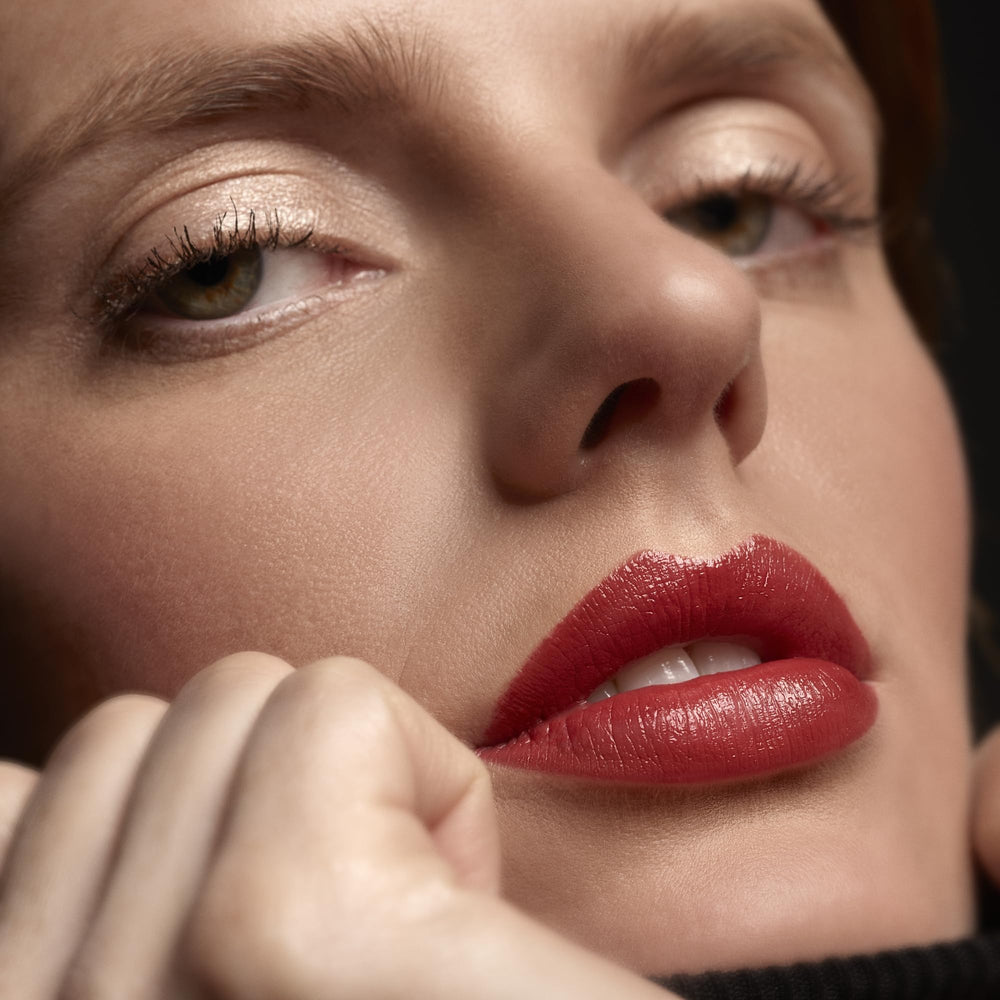 Sisley Phyto-Rouge applicator demonstrates precise application.