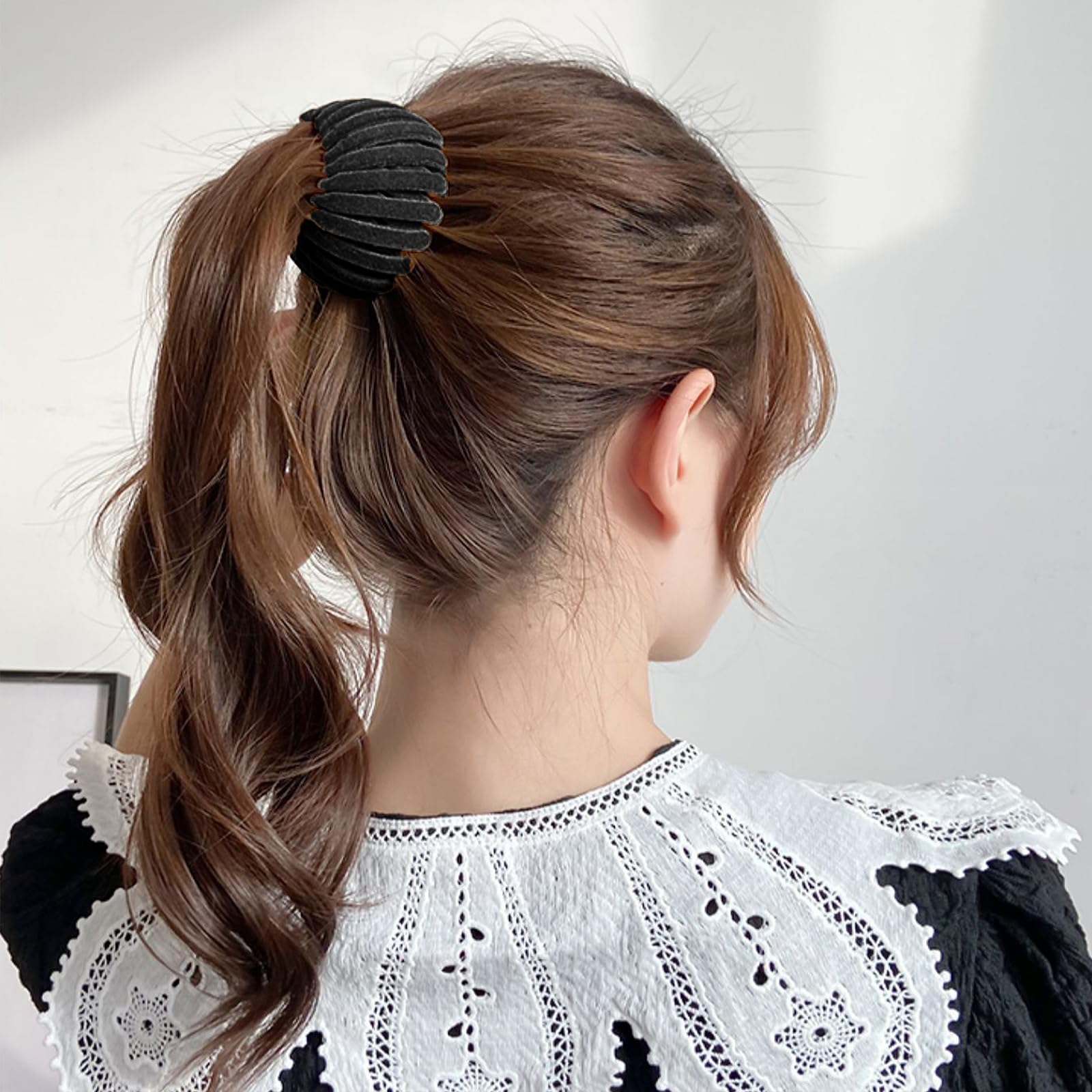 Sizobi clip used during cooking to keep hair tidy in black