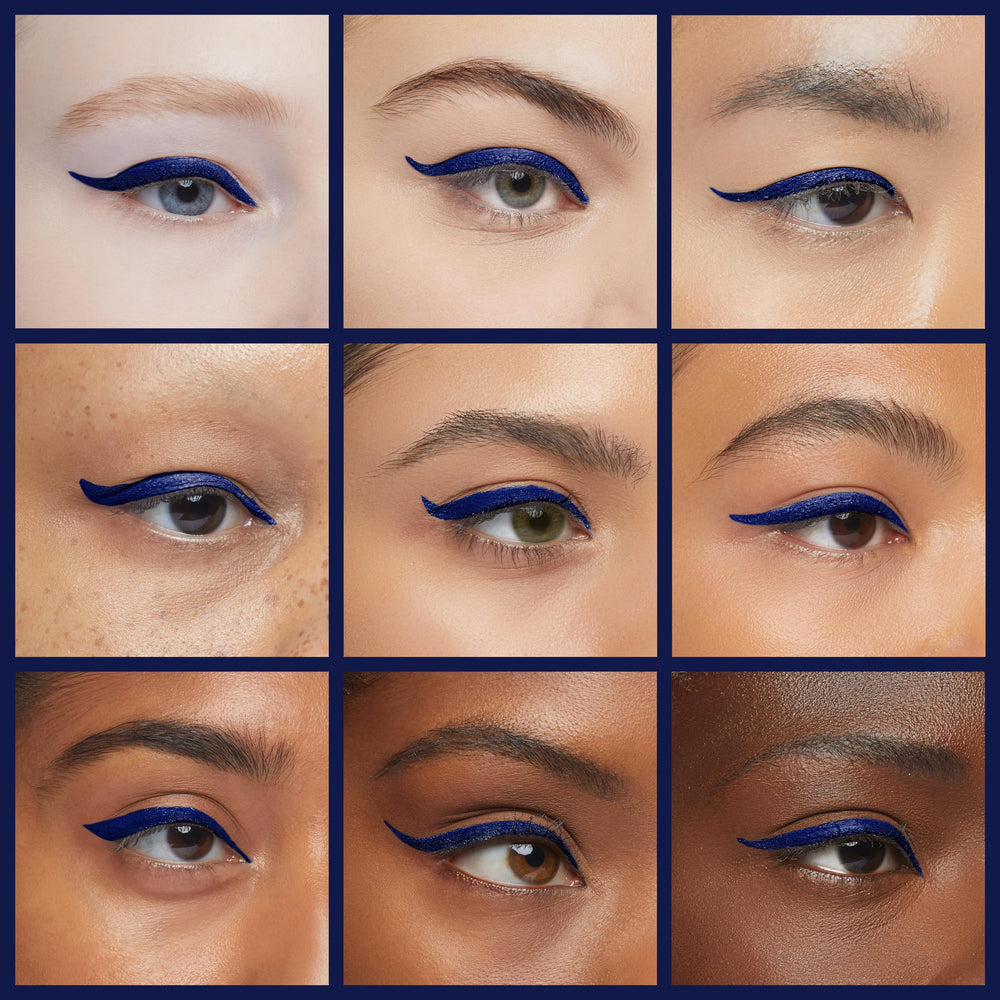 Skone navy eyeliner highlights sharp wing and defined eyes.