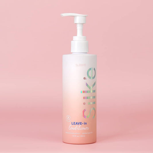 Sleek-e Silk-e Leave-In application on hair mid-lengths for smooth detangling.