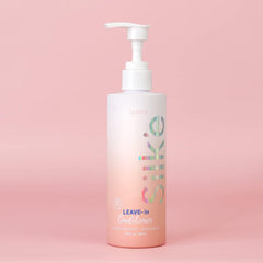 Sleek-e Silk-e Leave-In application on hair mid-lengths for smooth detangling.