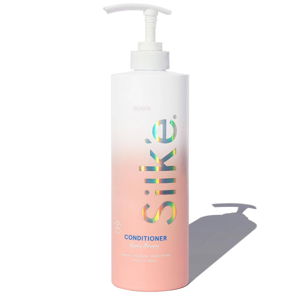 Sleek'e Silk'e Repair Therapy Conditioner bottle with paraben and sulfate free formula for damaged hair.