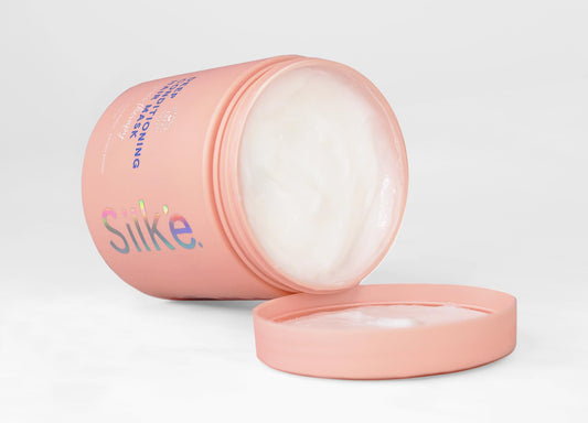 Sleek'e Silk'e Repair Therapy jar closeup, showcasing rich conditioning for nourished, healthy-looking hair.