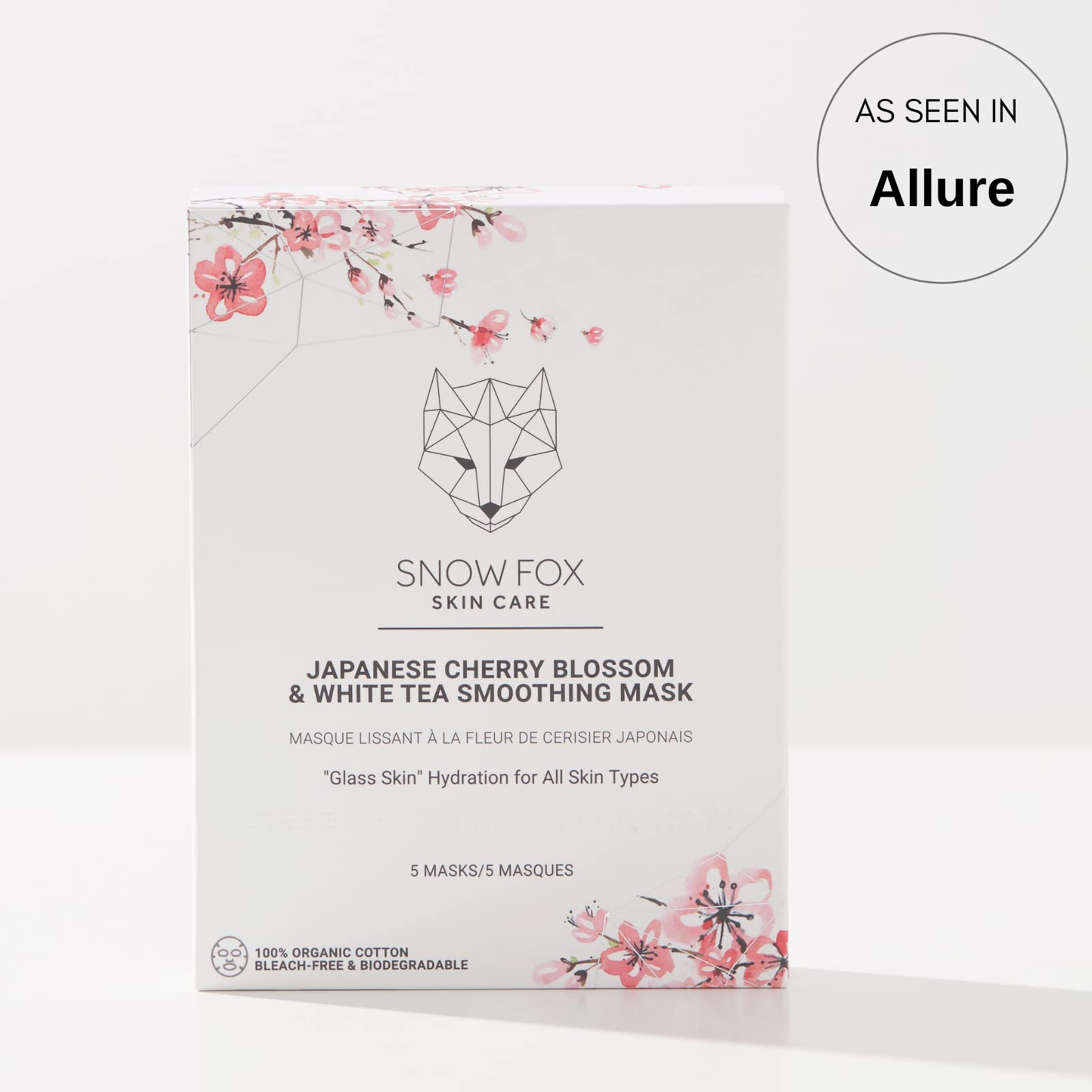 Snow Fox sheet mask drenched in serum, close-up showing moisturizing textures.