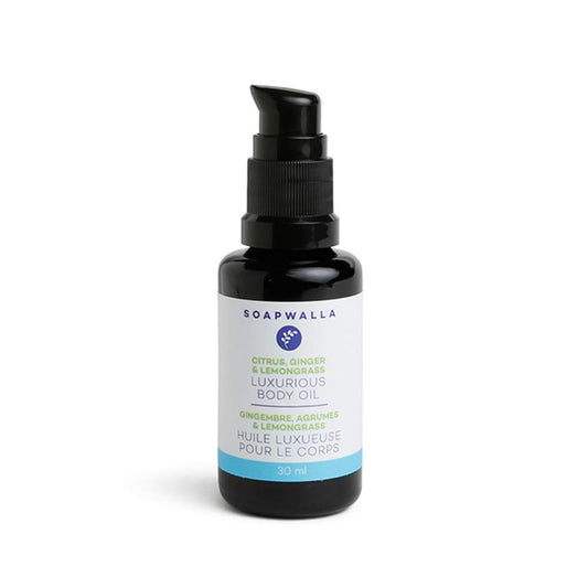 Soapwalla travel-size body oil bottle with ginger-citrus aroma for hydration.
