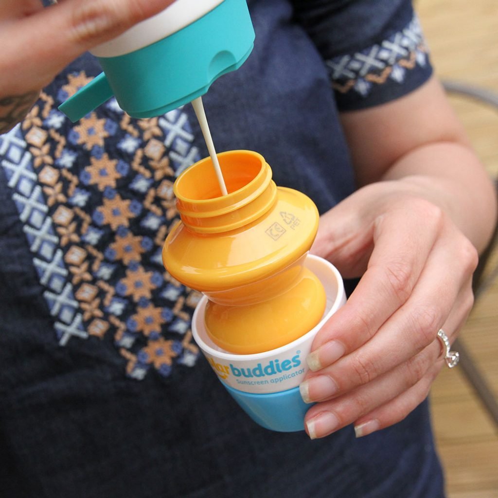 Solar Buddies Duo GB roll-on sponge applicator in-use showing quick lotion application for families