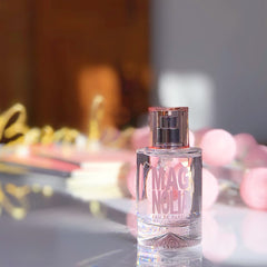 Floral arrangement around the Magnolia bottle for a fresh, accessible scent