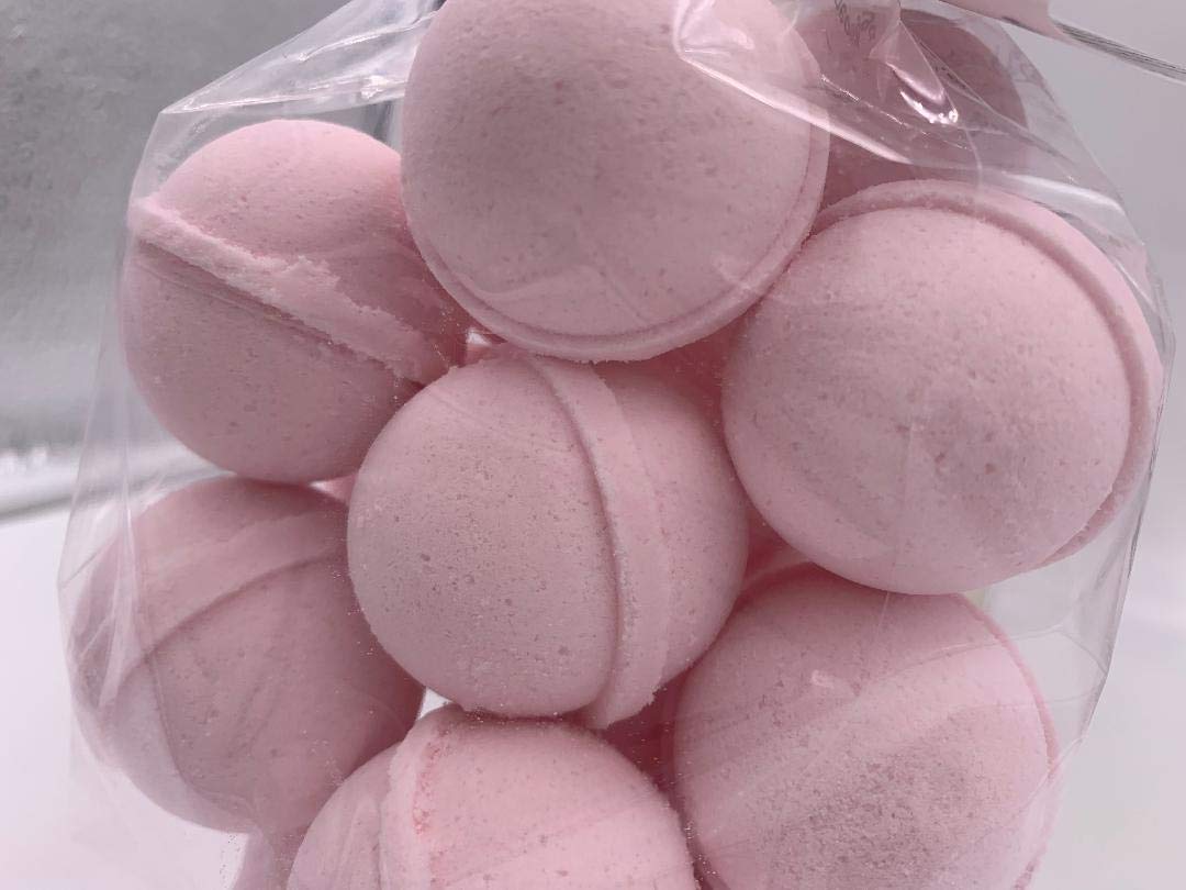 Spa Pure Pink Sugar Bath Bomb close-up with shea butter, showcasing moisturizing ingredients.