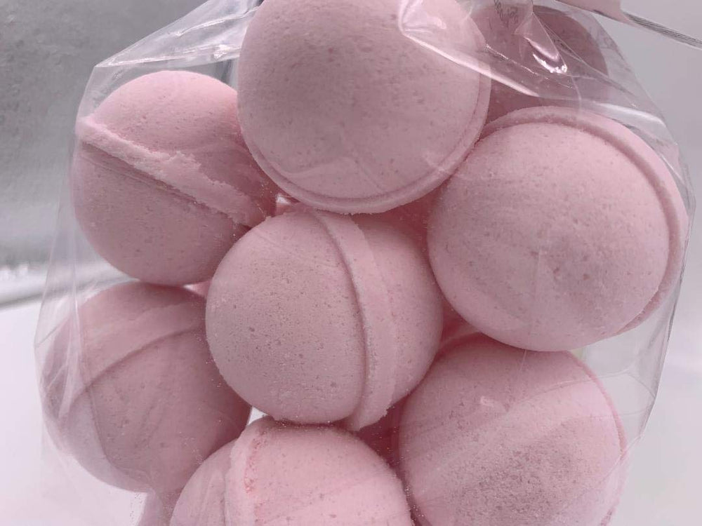 Spa Pure Pink Sugar Bath Bomb close-up with shea butter, showcasing moisturizing ingredients.