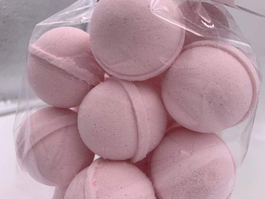 Spa Pure Pink Sugar Bath Bomb close-up with shea butter, showcasing moisturizing ingredients.