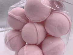 Spa Pure Pink Sugar Bath Bomb close-up with shea butter, showcasing moisturizing ingredients.