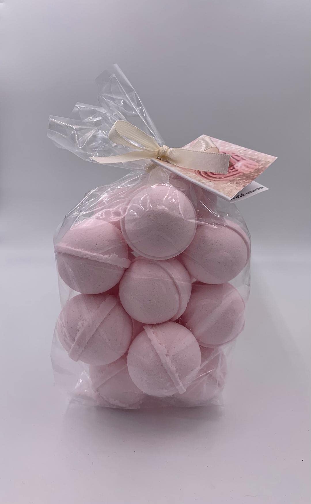 Spa Pure Pink Sugar Bath Bomb packaging with hang tag and ribbon, a thoughtful gift.