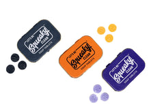 SqueakyClean charcoal tablet in tin for fast, mess-free cleansing