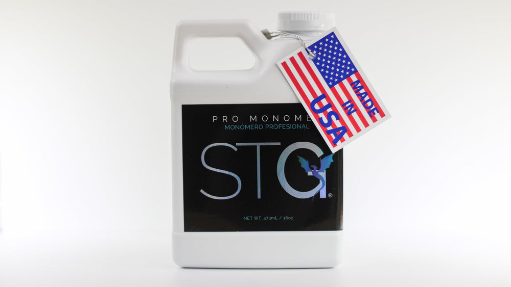 STG acrylic monomer purple bottle for smooth sculpting and color clarity.