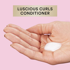 Suave Luscious Curls detangling action shown on tangled curls.