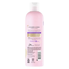 Suave Luscious Curls conditioner pour highlights detangling properties for curly hair.
