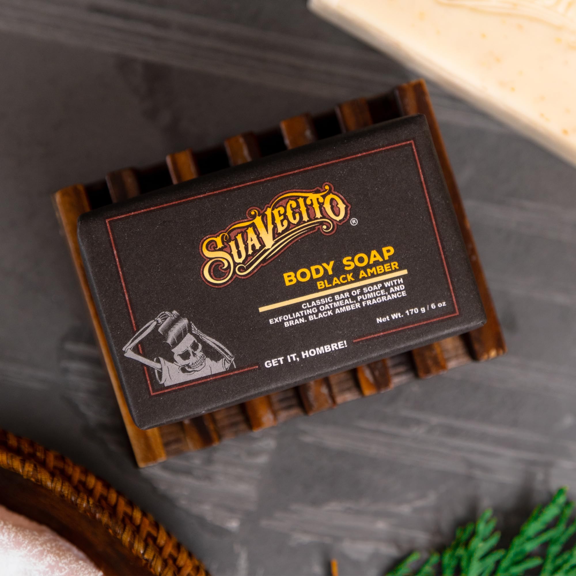 Hands lathering with Suavecito soap showing rich foam and scent.