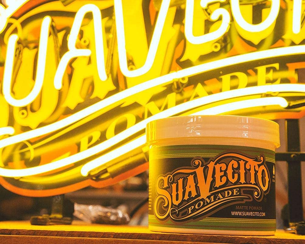 Suavecito Pomade Matte model brushing hair shows flexible hold.