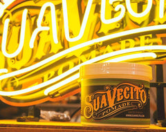 Suavecito Pomade Matte model brushing hair shows flexible hold.