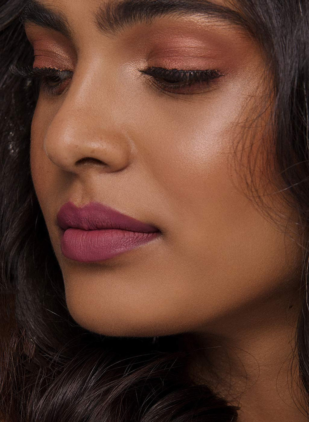 Lily Aldrin shade on lips for day to night looks with a mauve pink tint