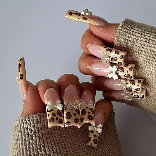 SUMINGGO almond press-on nails in leopard bowknot design for instant, salon-like manicure.
