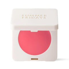 Summer Fridays Blush Butter Balm Pink Sunset tube close-up showing travel-ready color.