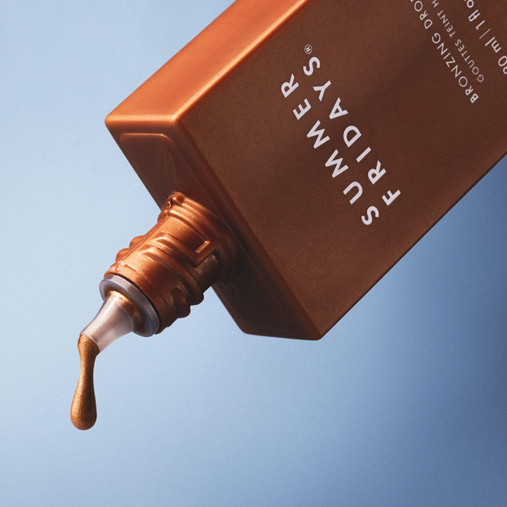 Summer Fridays Bronzing Drops on hand demonstrates quick application for subtle bronze.