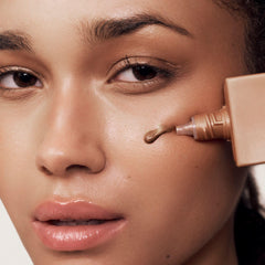 Summer Fridays Bronzing Drops mixed with moisturizer to boost radiance.