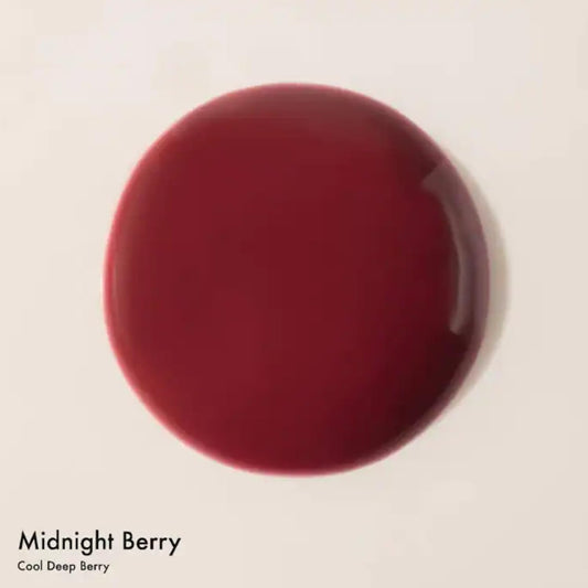 Dream Lip Oil Midnight Berry swatch showing sheer tint and gloss.