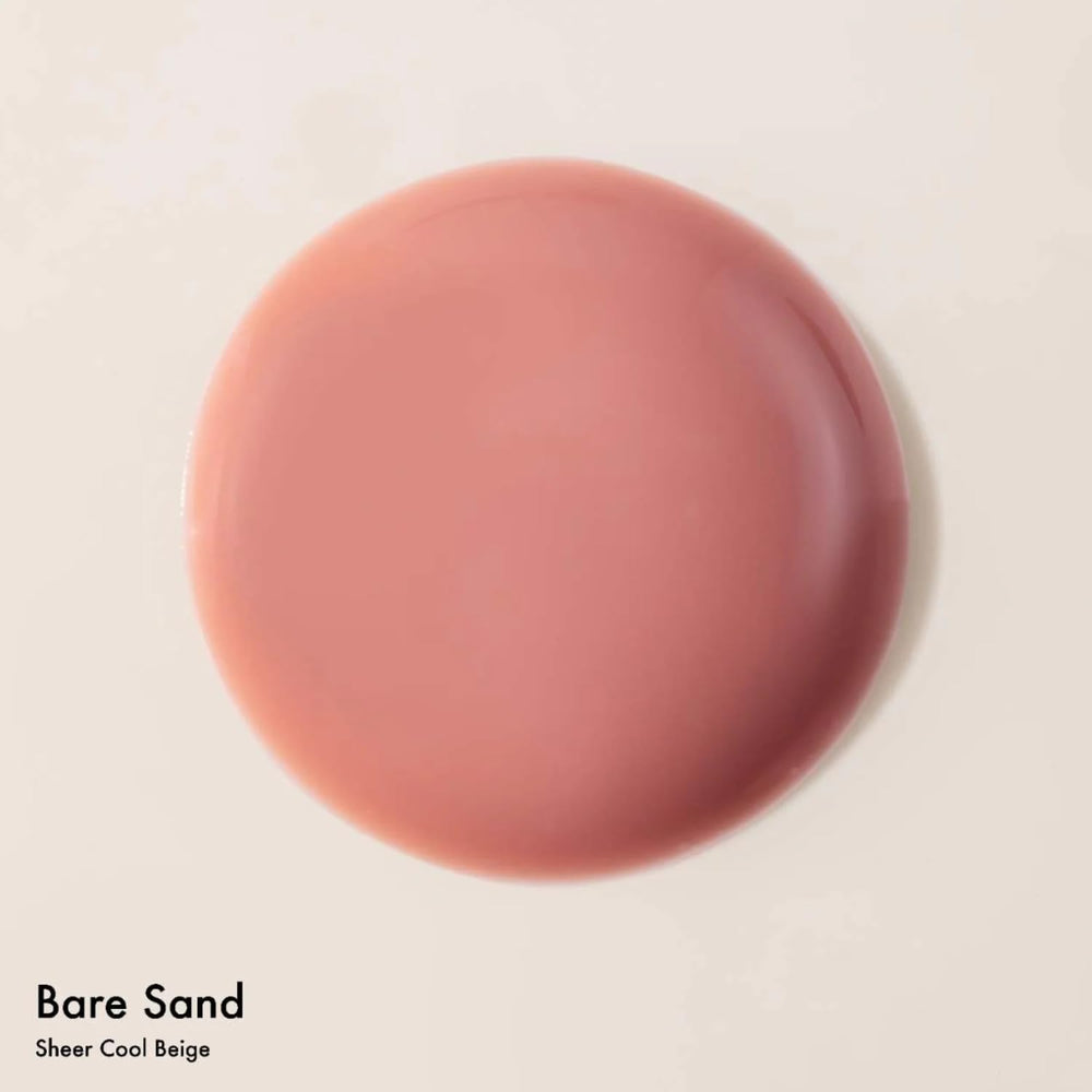 Dream Lip Oil tube cap close-up highlights high-shine tint and smooth application