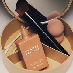 Summer Fridays Illuminating Drops mixed with foundation for radiant coverage.