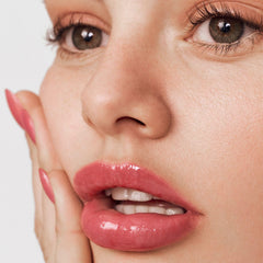 Close-up texture of Summer Fridays Pink Guava lip balm appears smooth and non-greasy.