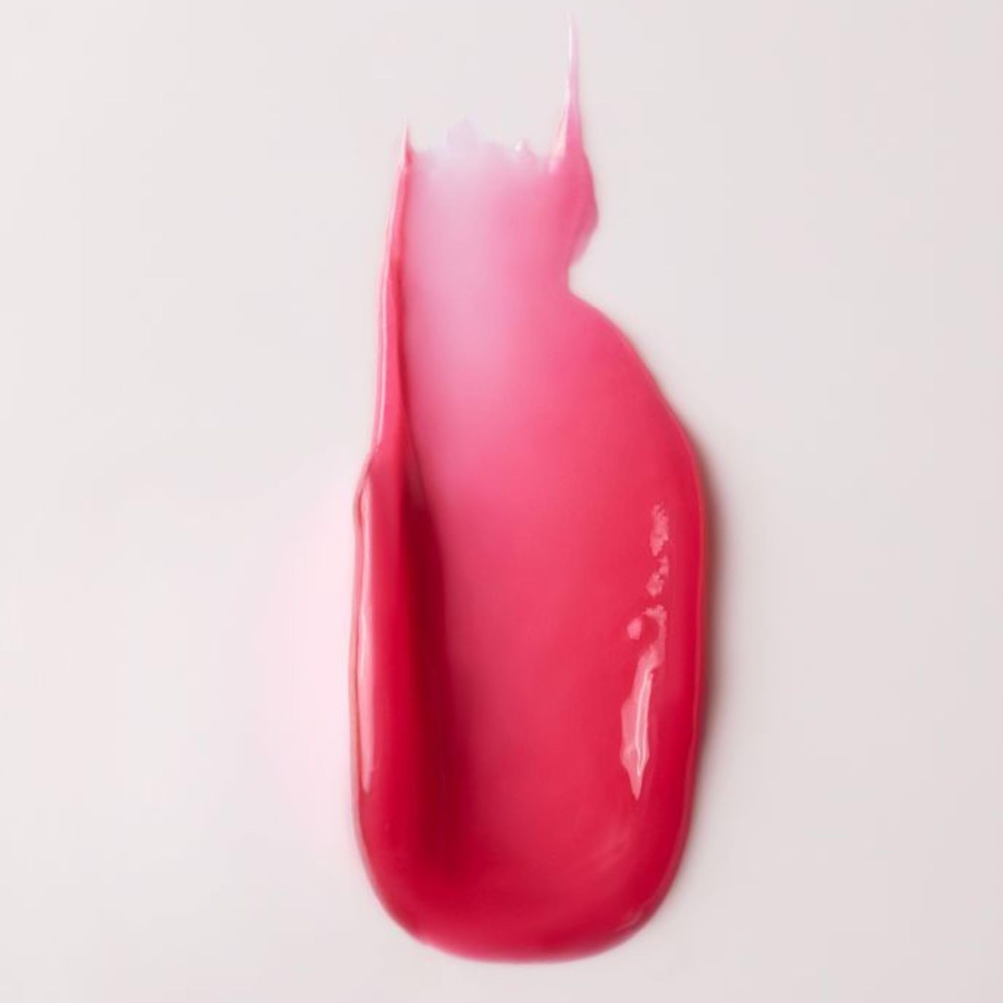 Swatch showing sheer color and natural shine of Summer Fridays Pink Guava lip balm.