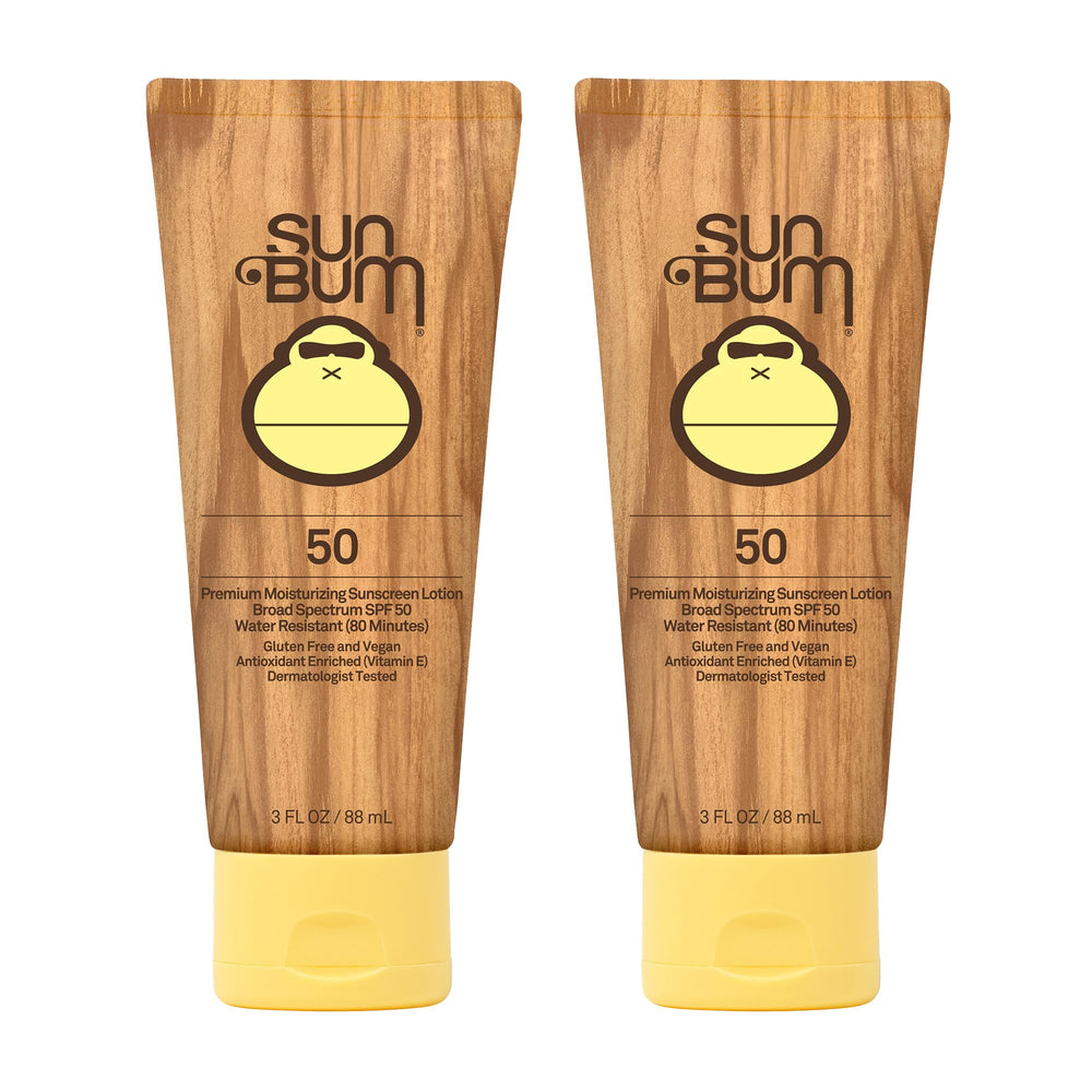 Sun Bum Original SPF 50 sunscreen lotion bottle safeguards skin at the beach.