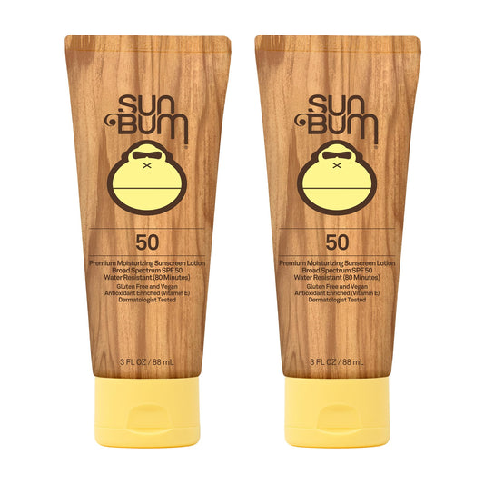 Sun Bum Original SPF 50 sunscreen lotion bottle safeguards skin at the beach.