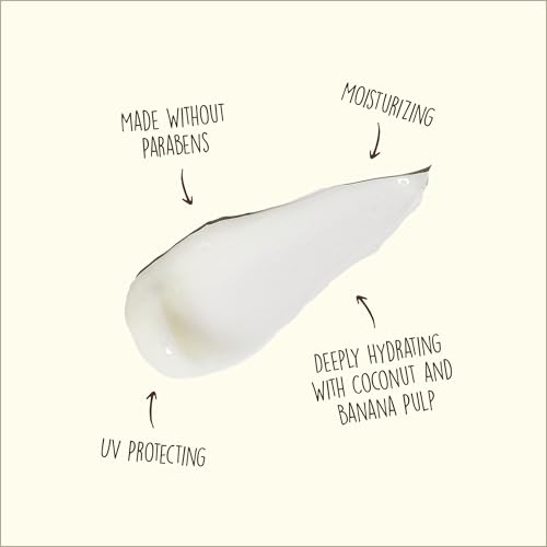 Close-up of shampoo ingredients highlighting coconut oil and banana benefits.