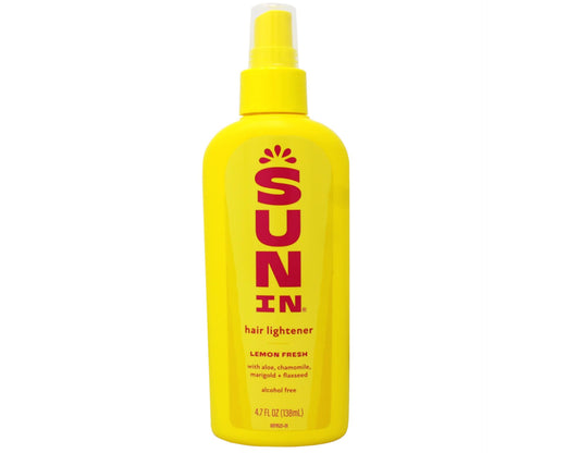 Sun-In hair lightener outdoors uses warmth to brighten natural highlights.