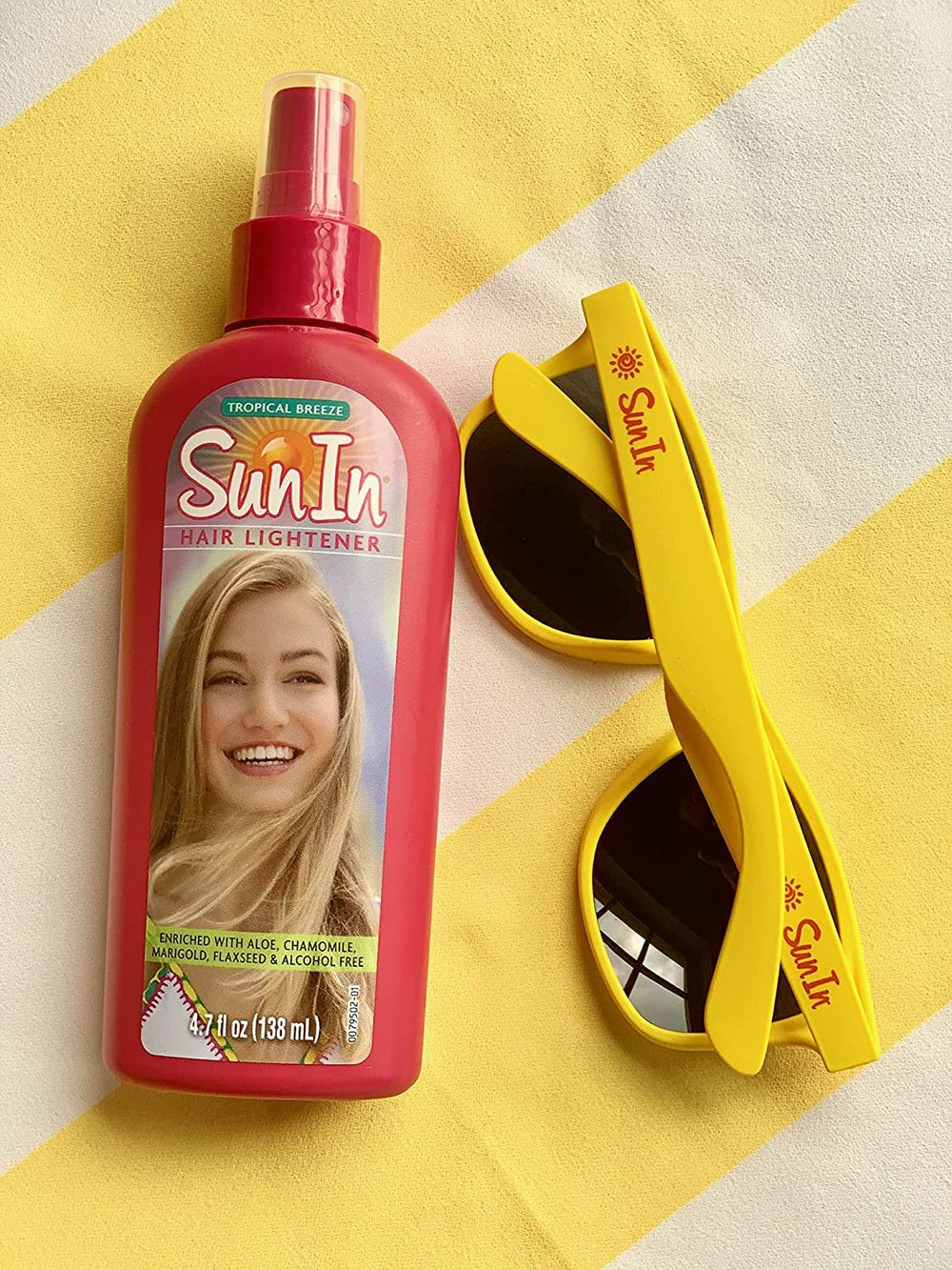 Brunette with sun-kissed glow after using Sun-In Original Spray-In Lightener