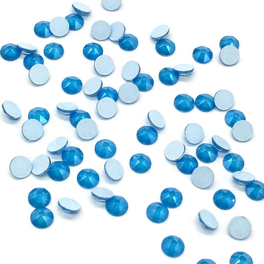Sun Tangerine Swarovski 2088 Xirius Electric Blue flat backs for long-lasting nail art shine.