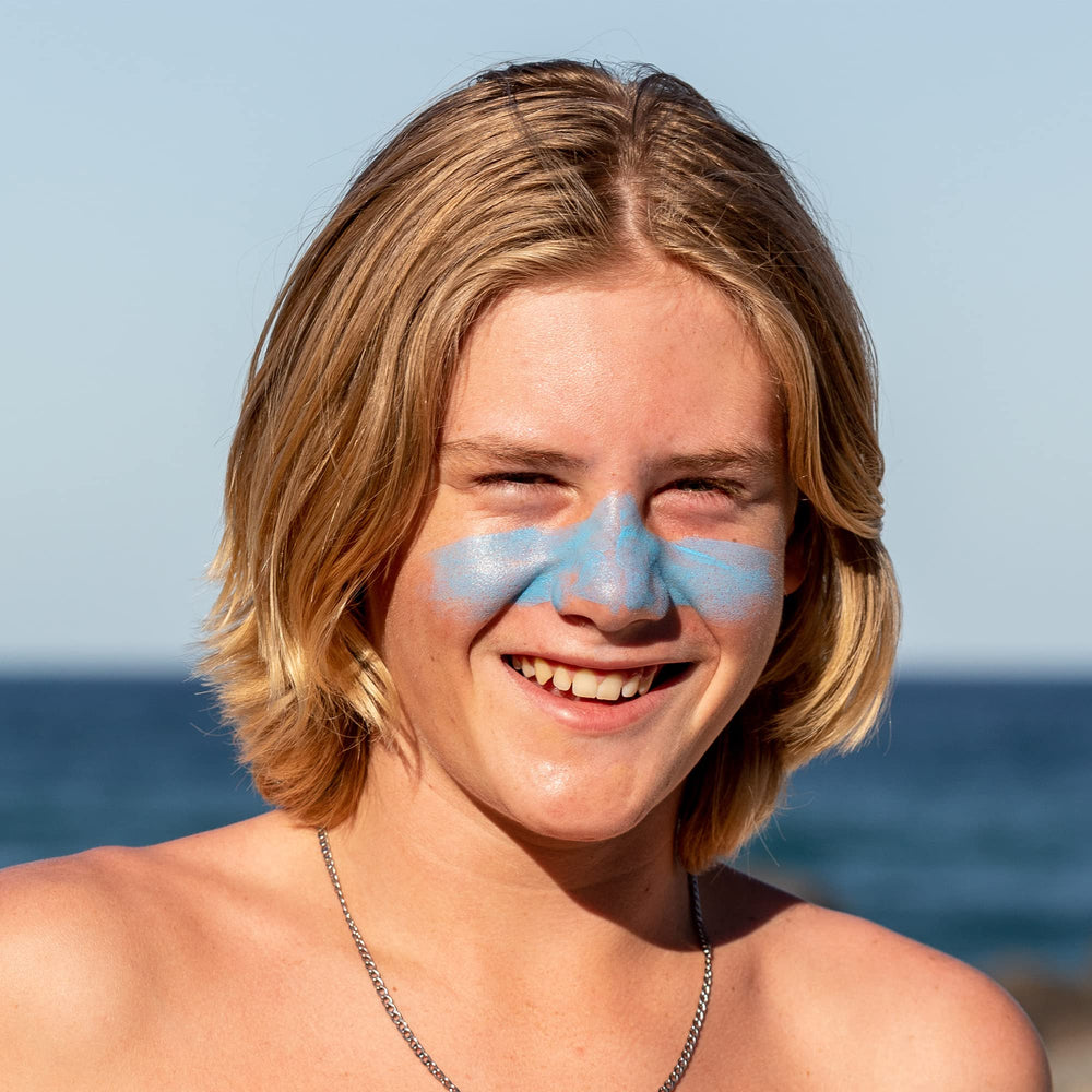 Sun Zapper SPF 50+ blue stick applied on skin for all-day coverage.