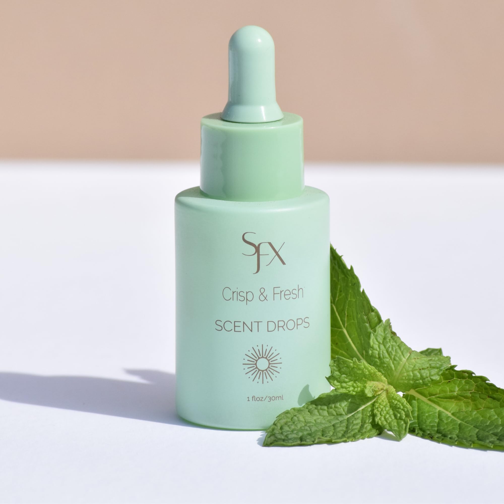 SunFX Scent Drops added to tanning solution for enhanced aroma during spray tan.